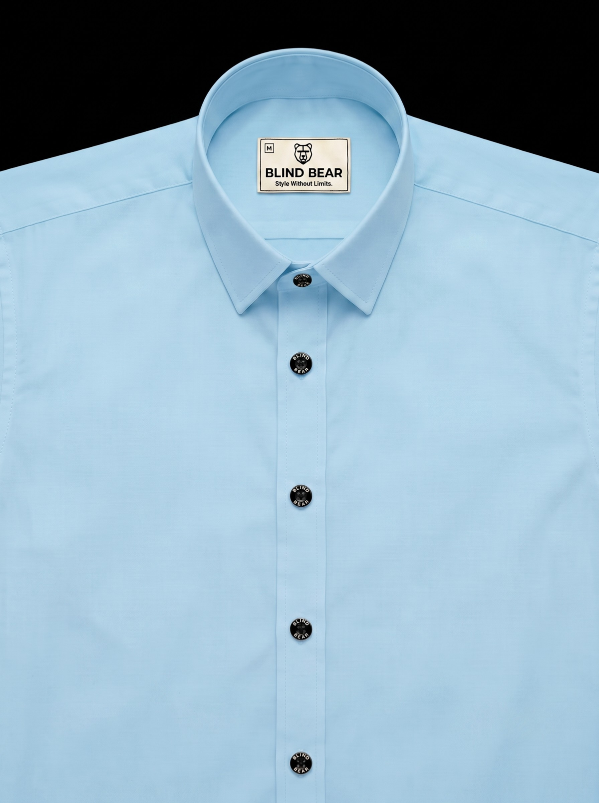 A light blue long-sleeve dress shirt by Blind Bear, featuring a classic pointed collar, black buttons, and a visible brand label inside the collar, set against a solid black background.